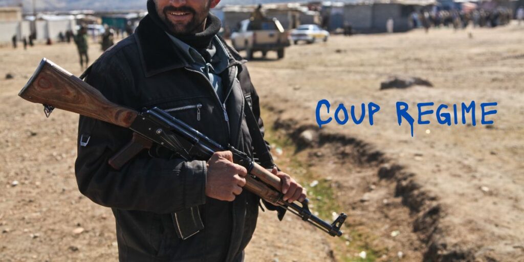 小銃を持って立つ兵士。

テキストメッセージで

「coup regime」

と書いてある。