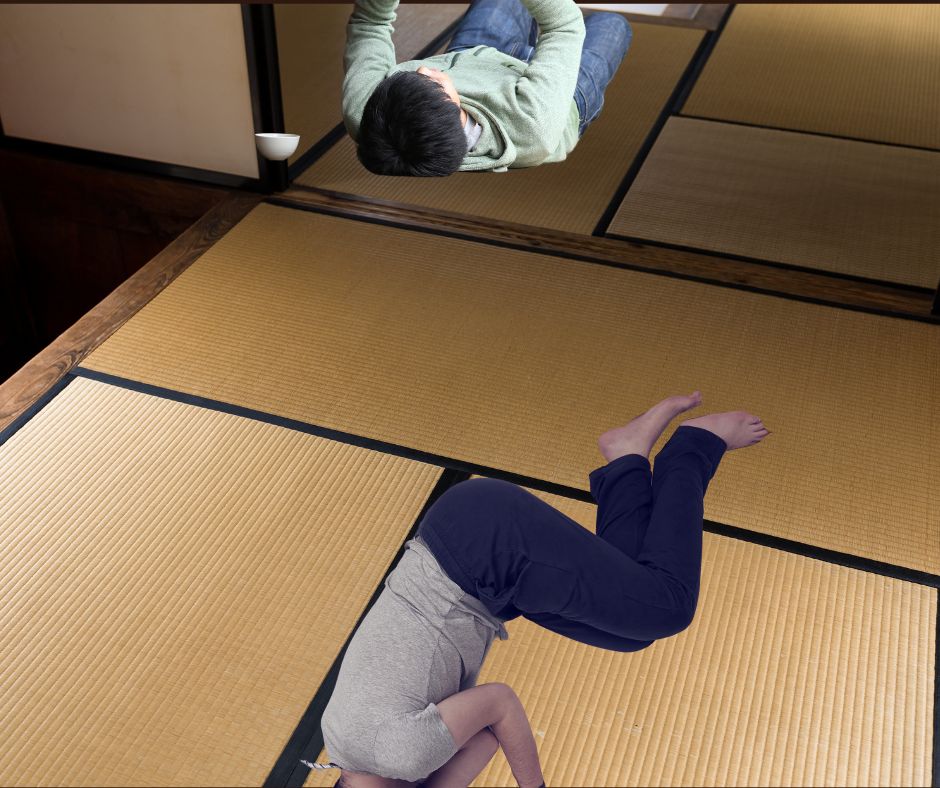 Two men lying on tatami