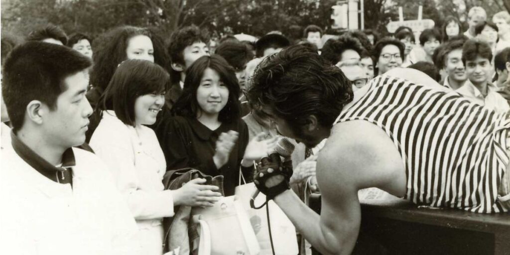 Rock singer surrounded by customers