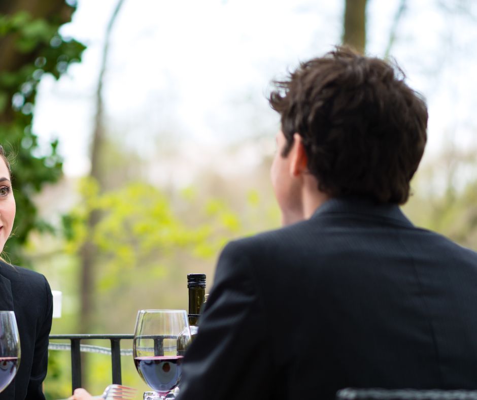 A man speaks confidently while eating