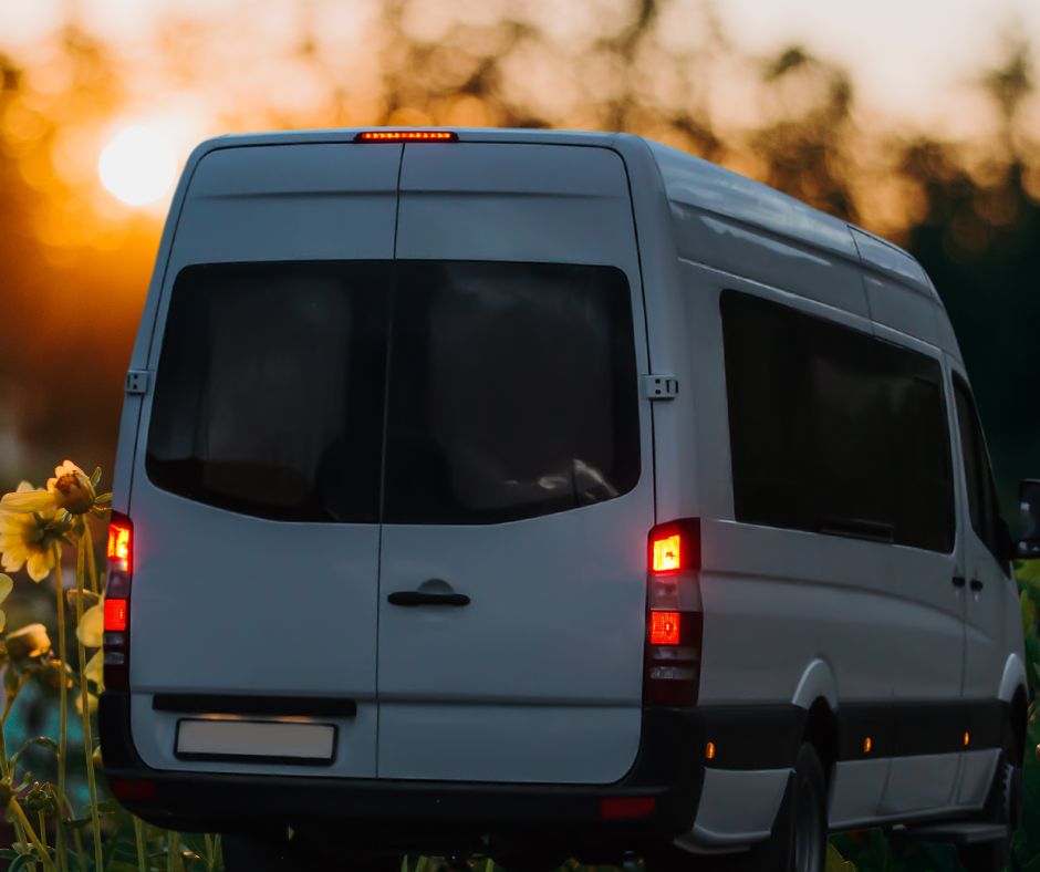 Car running on a mountain road at sunset